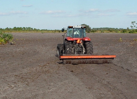water filled roller firming soil prior to seeding